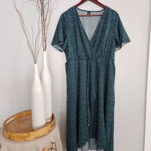 Womans green polka-dot wrap dress